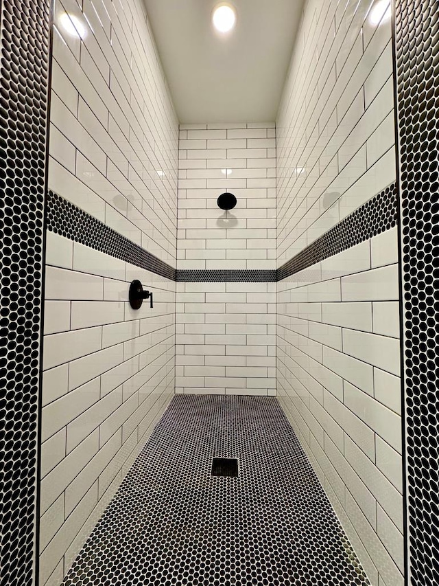 bathroom with tiled shower