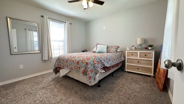 bedroom with dark colored carpet and ceiling fan