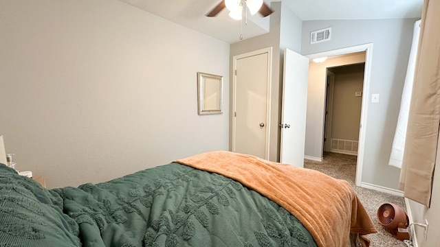 carpeted bedroom with lofted ceiling and ceiling fan