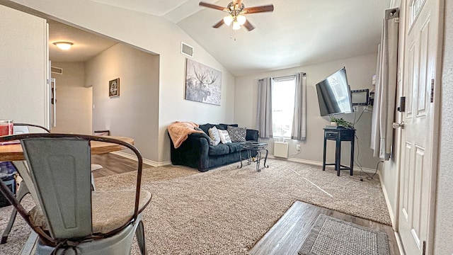 carpeted living room with lofted ceiling and ceiling fan