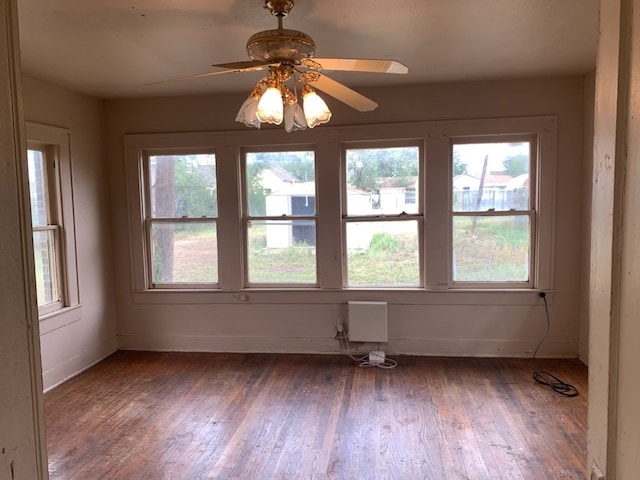 606 Pulliam St, San Angelo, TX 76903 - unfurnished room featuring wood finished floors, baseboards, and a ceiling fan