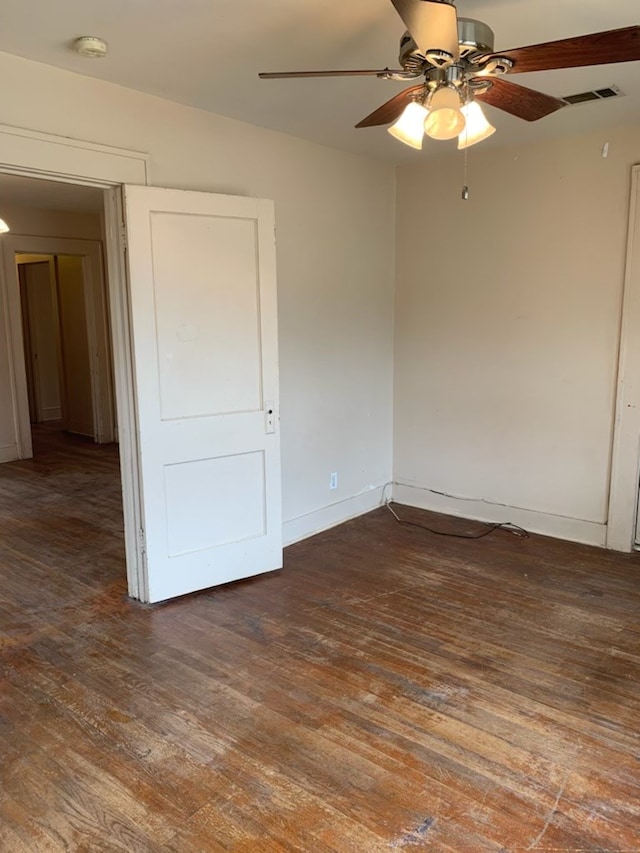 606 Pulliam St, San Angelo, TX 76903 - spare room with a ceiling fan, hardwood / wood-style floors, a smoke detector, and baseboards