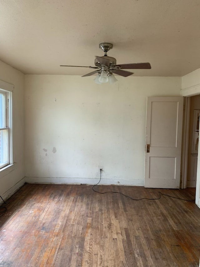 606 Pulliam St, San Angelo, TX 76903 - unfurnished room featuring wood-type flooring, ceiling fan, and baseboards
