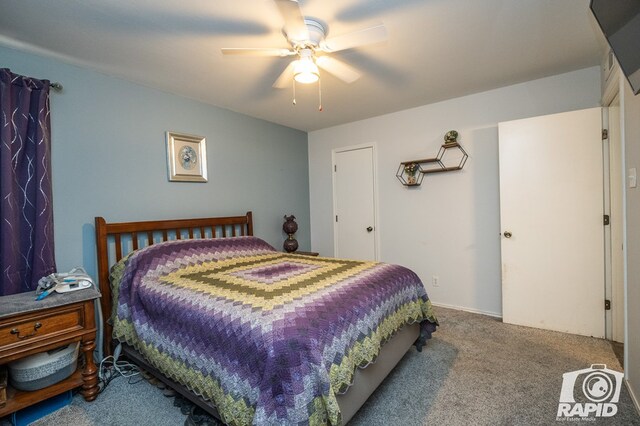 carpeted bedroom featuring a ceiling fan