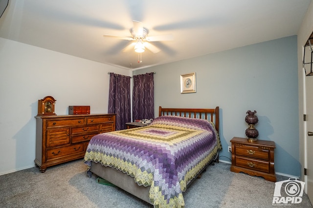 carpeted bedroom with a ceiling fan