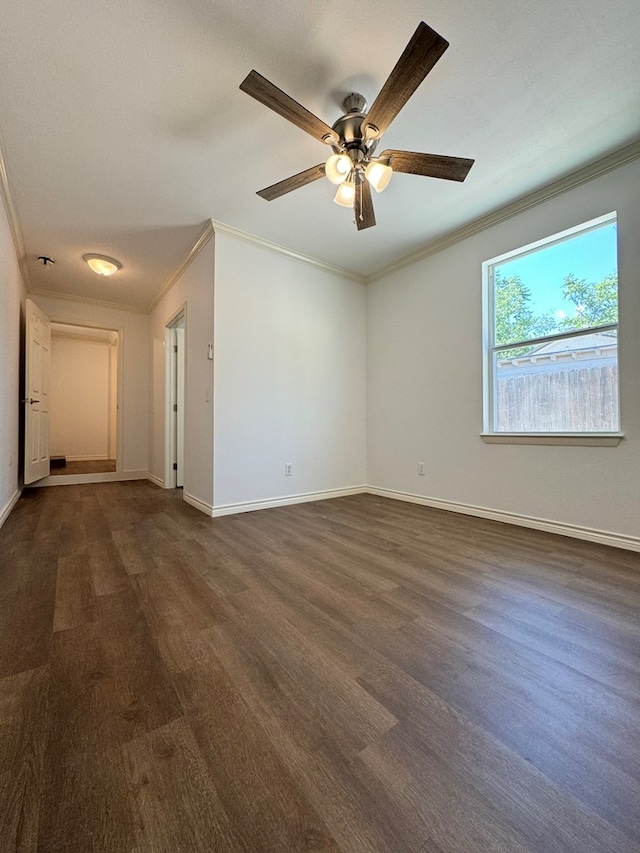 empty room with ceiling fan and ornamental molding