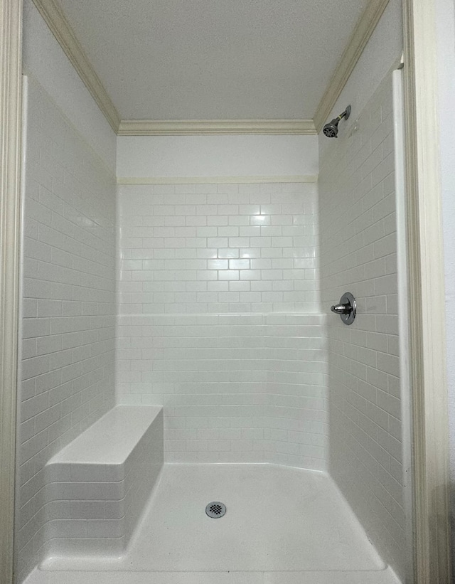 bathroom with a shower and crown molding