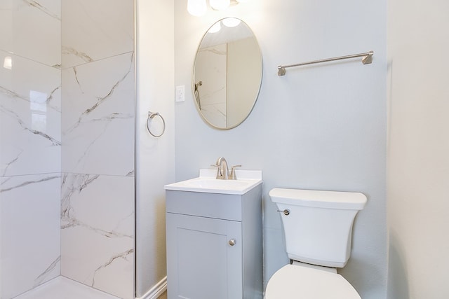 full bath featuring toilet, walk in shower, and vanity