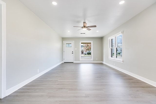 interior space with visible vents, baseboards, wood finished floors, and recessed lighting