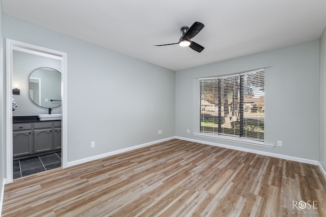 3421 Clearview Dr, San Angelo, TX 76904 - unfurnished bedroom with light wood-style flooring, ensuite bathroom, and ceiling fan