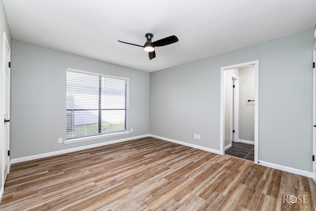 3421 Clearview Dr, San Angelo, TX 76904 - unfurnished bedroom with wood finished floors and a ceiling fan