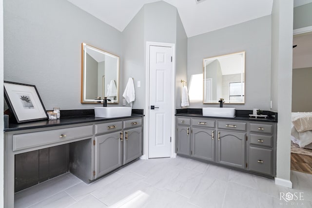 3421 Clearview Dr, San Angelo, TX 76904 - bathroom with two vanities and lofted ceiling