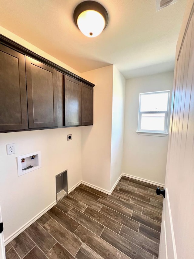 2009 Hudson St, San Angelo, TX 76903 - washroom with cabinet space, hookup for a washing machine, electric dryer hookup, wood tiled floors, and baseboards