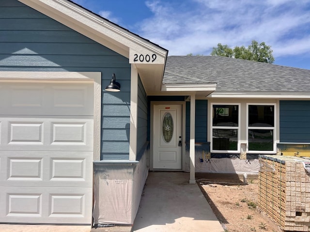 2009 Hudson St, San Angelo, TX 76903 - entrance to property with an attached garage and roof with shingles