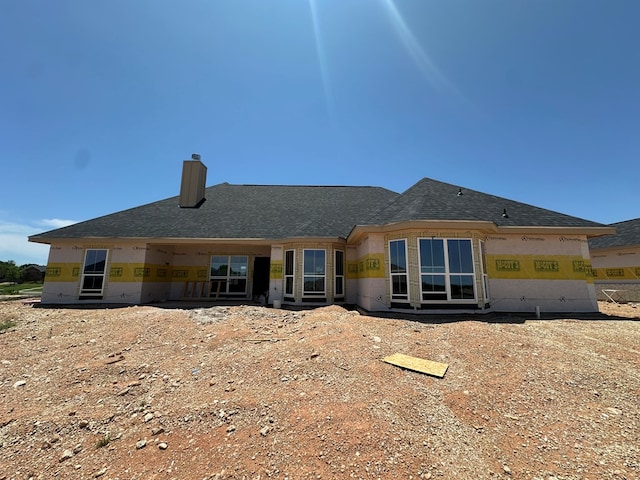 3622 Silver Spur Dr, San Angelo, TX 76904 - back of property featuring a chimney