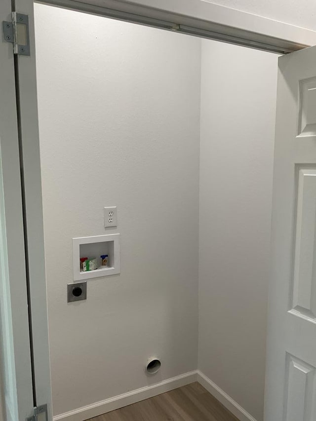 laundry area with hookup for a washing machine, electric dryer hookup, and dark wood-type flooring