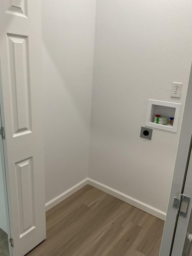 laundry area with washer hookup, hookup for an electric dryer, and wood-type flooring