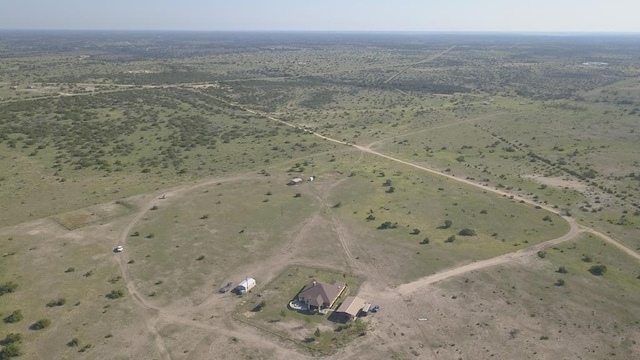 birds eye view of property featuring a rural view