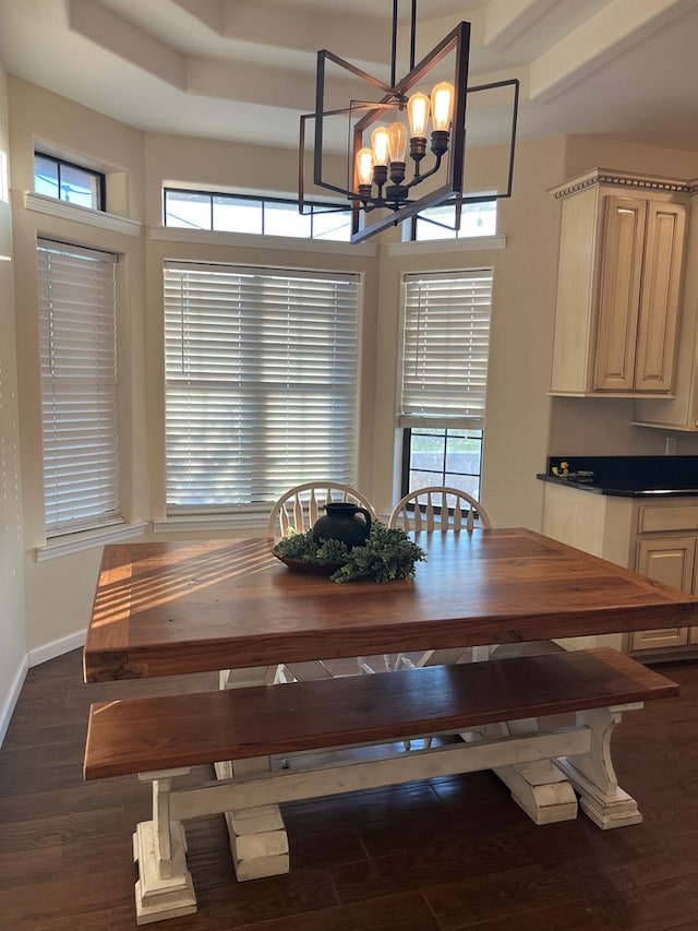 dining area featuring dark hardwood / wood-style flooring and an inviting chandelier