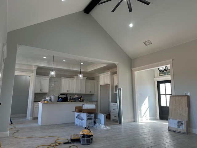 details with beam ceiling and a stone fireplace