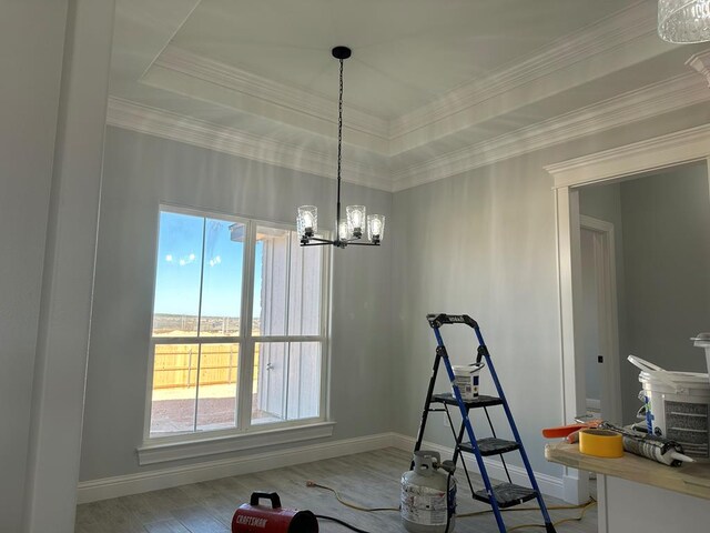 kitchen with crown molding and a tray ceiling