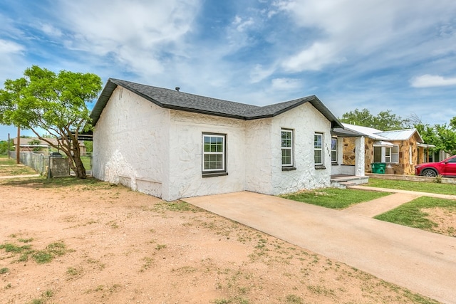 2624 Dallas St, San Angelo, TX 76903 - view of home's exterior with stucco siding and fence