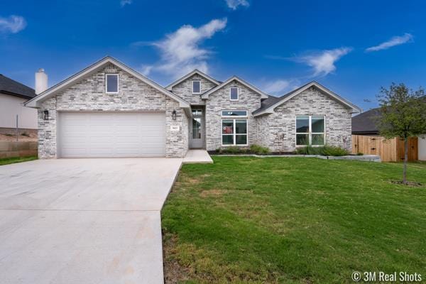 view of front facade with a garage and a front yard