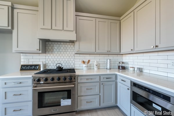 kitchen featuring decorative backsplash and appliances with stainless steel finishes