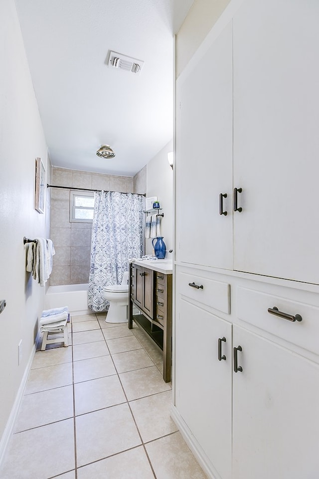 2709 Janie Ln, San Angelo, TX 76905 - bathroom featuring tile patterned flooring, shower / bath combination with curtain, vanity, toilet, and baseboards