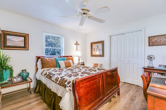 2709 Janie Ln, San Angelo, TX 76905 - bedroom featuring a closet, light wood-type flooring, and a ceiling fan