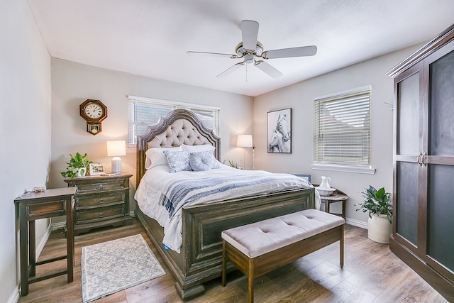 2709 Janie Ln, San Angelo, TX 76905 - bedroom with wood finished floors, a ceiling fan, and baseboards