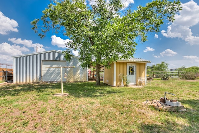 2709 Janie Ln, San Angelo, TX 76905 - view of yard with a garage, an outbuilding, and a pole building