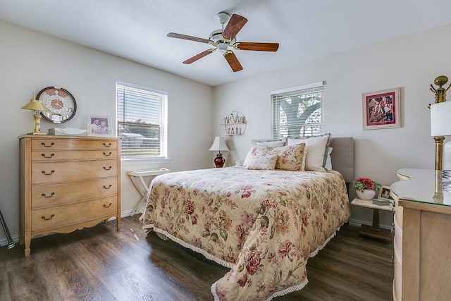 2709 Janie Ln, San Angelo, TX 76905 - bedroom featuring dark wood finished floors, baseboards, and ceiling fan