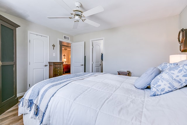 2709 Janie Ln, San Angelo, TX 76905 - bedroom with wood finished floors, a ceiling fan, and baseboards