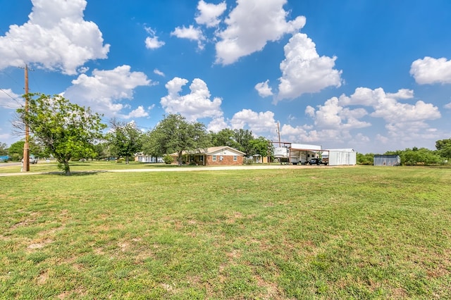 2709 Janie Ln, San Angelo, TX 76905 - view of grassy yard featuring a detached carport