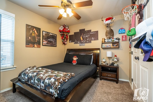 bedroom with ceiling fan and carpet flooring