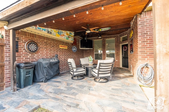 view of patio / terrace featuring area for grilling and ceiling fan