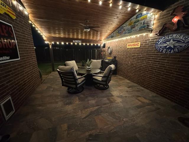 wine cellar featuring lofted ceiling, brick wall, and wooden ceiling