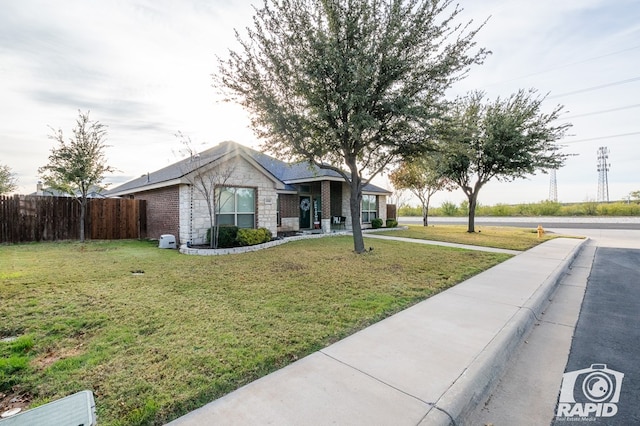 ranch-style house featuring a front yard