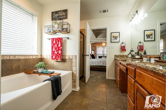 bathroom featuring vanity and a bathing tub