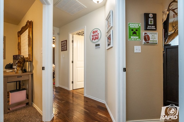 hallway with dark hardwood / wood-style flooring