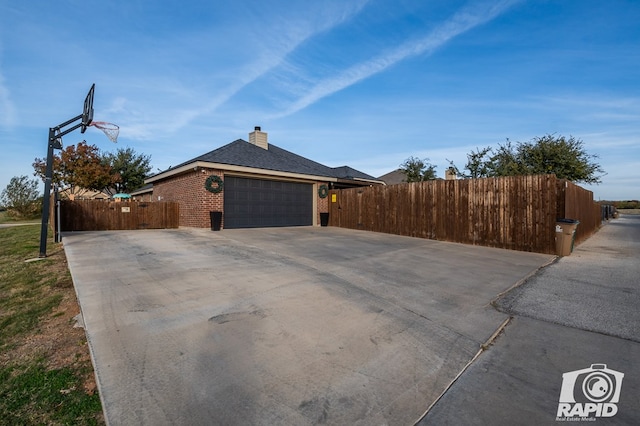 view of side of home featuring a garage