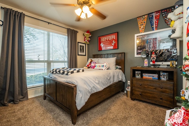 bedroom with multiple windows, carpet, and ceiling fan