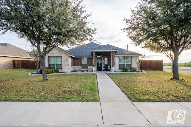 view of front of home with a front lawn