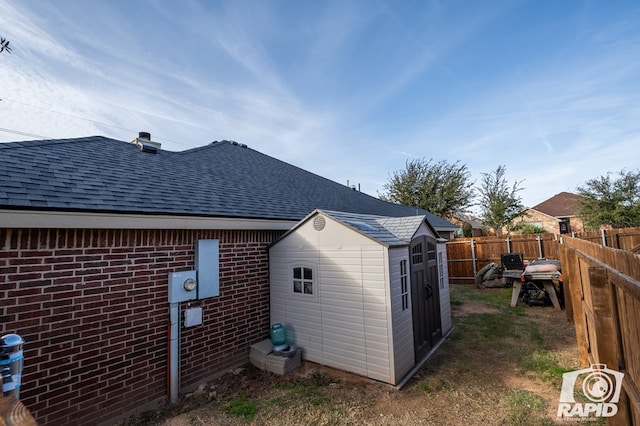 exterior space with a storage shed