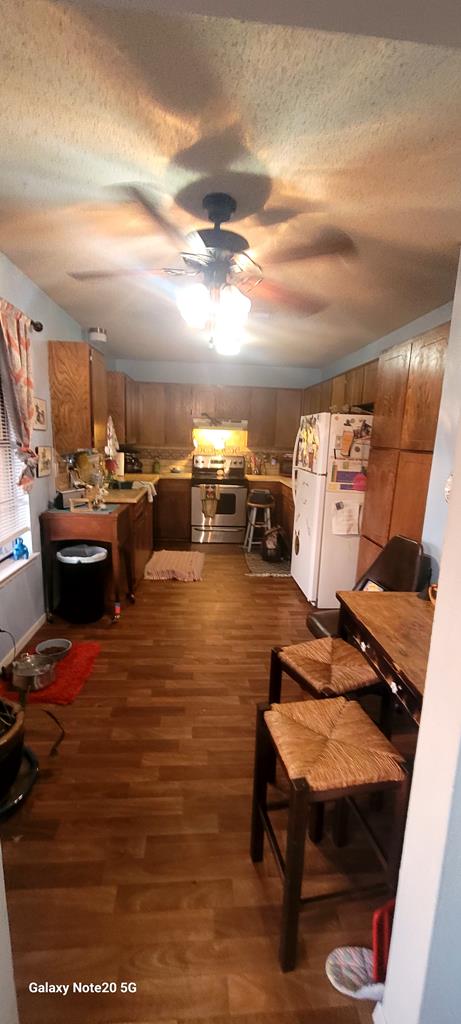 interior space featuring ceiling fan