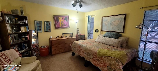 bedroom featuring carpet flooring and a textured ceiling