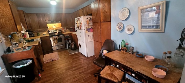 kitchen featuring stainless steel range with electric stovetop, tasteful backsplash, dark hardwood / wood-style floors, and white refrigerator