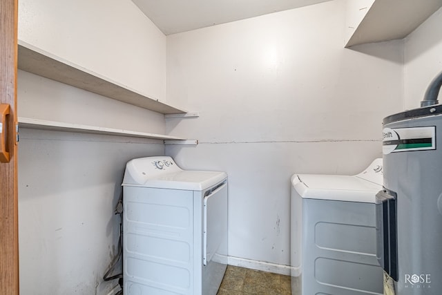 laundry room featuring washer and clothes dryer and water heater