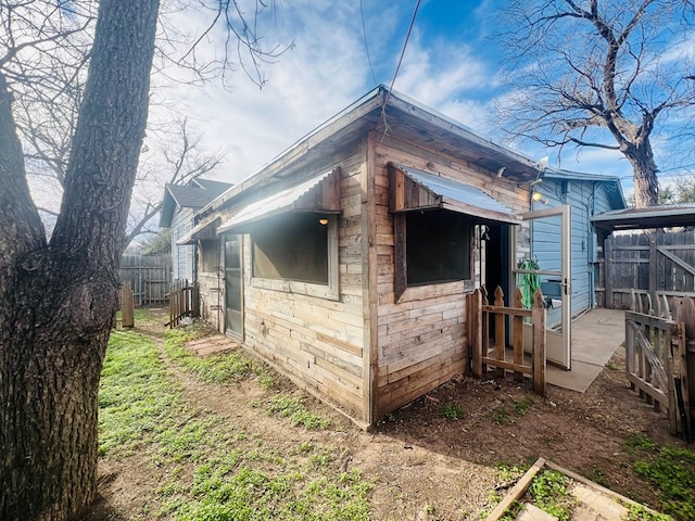 view of outdoor structure featuring fence